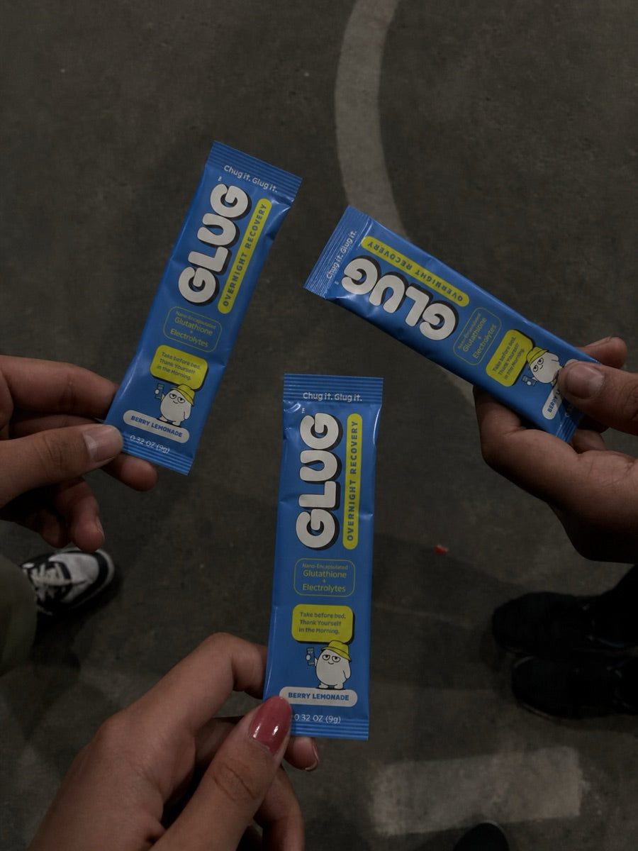 Friends holding Glug Berry Lemonade sticks